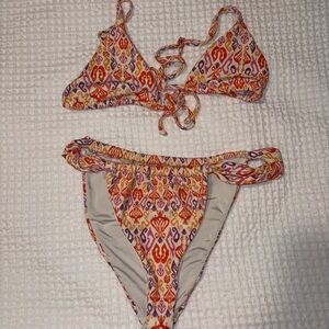 Dippin’ Daisy Triangle Swim Top with Orange & Pink Print Trim
